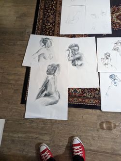 The three charcoal sketches from before, arranged together