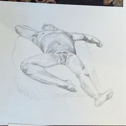 A pencil sketch of the same man lying down with his feet towards us